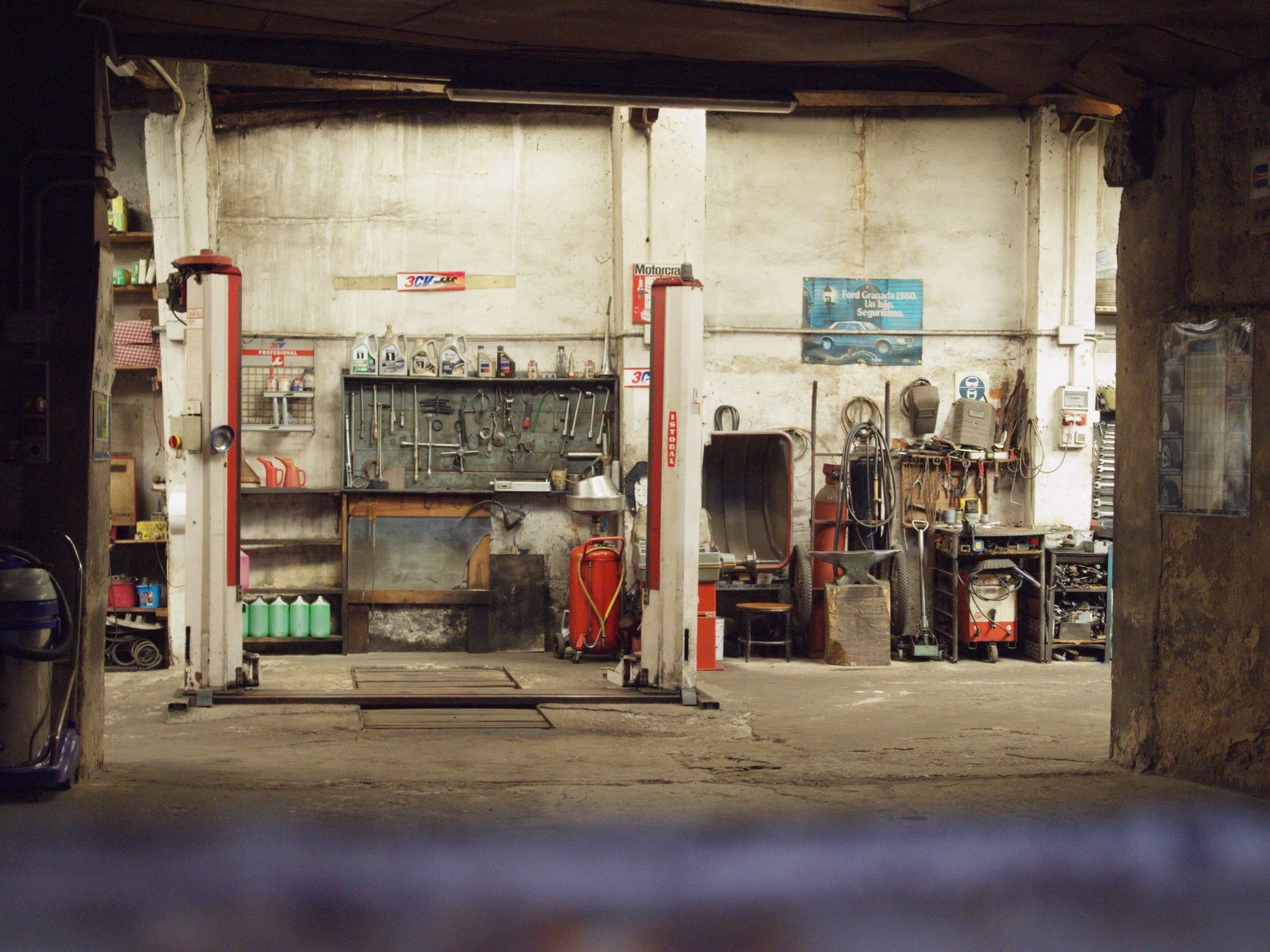 The workshop interior with tools, benches and hoists